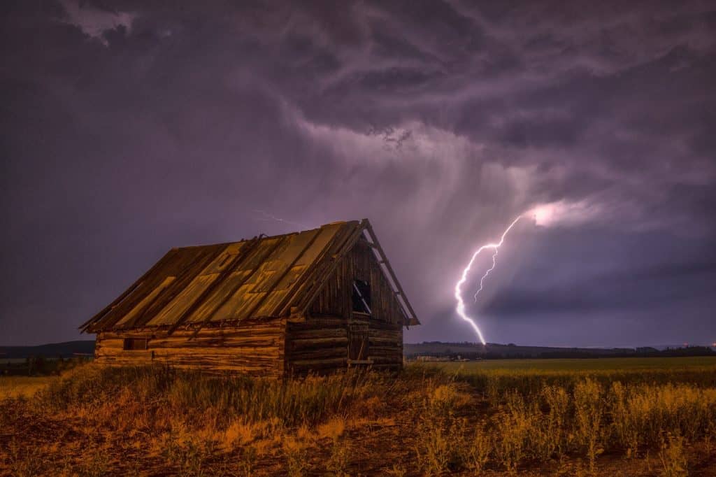 Lightening storm over an old barn