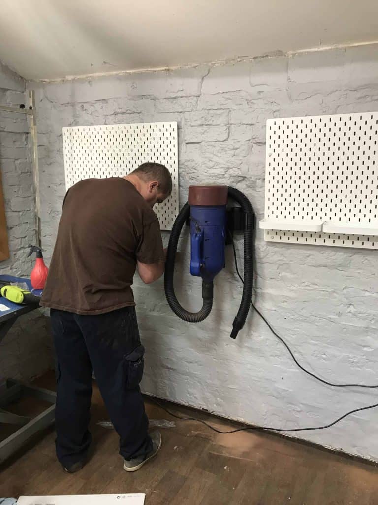 Hanging new racking and wall mounted tools at Scruffies salon